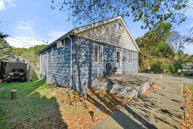 view of home's exterior with a yard