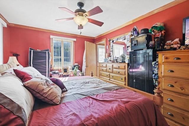 bedroom featuring ceiling fan and ornamental molding