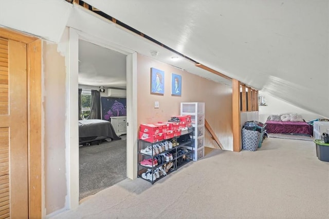 carpeted bedroom with lofted ceiling