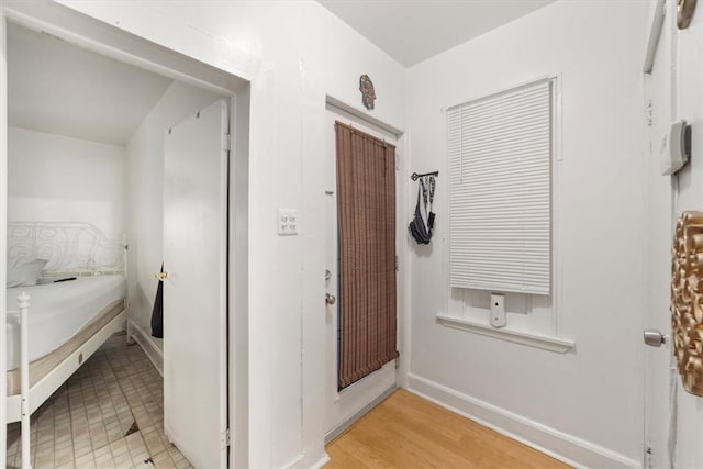 hallway featuring hardwood / wood-style flooring