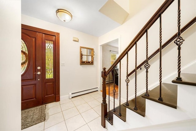 entryway with plenty of natural light, light tile patterned floors, and a baseboard heating unit