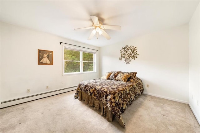 carpeted bedroom with baseboard heating and ceiling fan