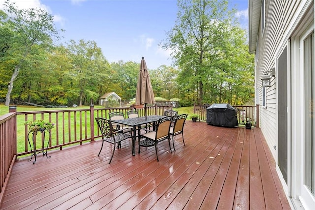 wooden deck with a yard