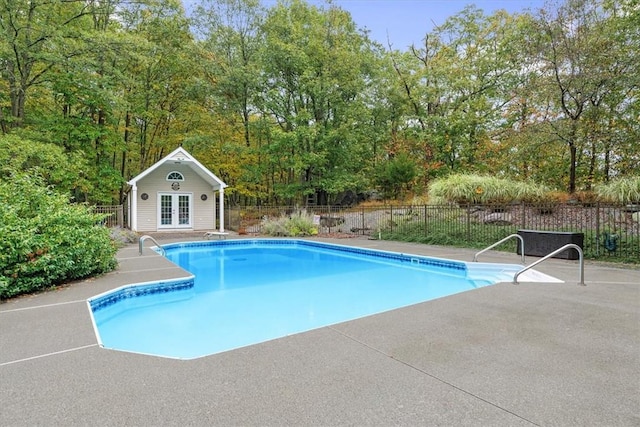 view of pool featuring a patio and an outdoor structure