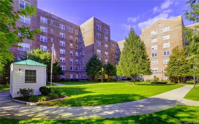 view of home's community with a yard