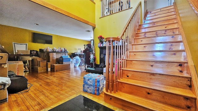 stairway with wood finished floors