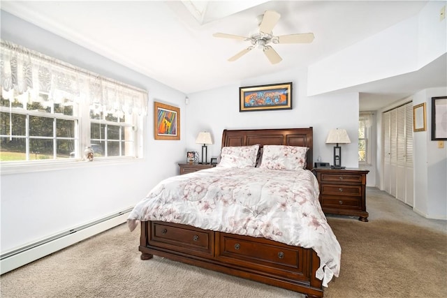 bedroom featuring ceiling fan, vaulted ceiling, light carpet, and a baseboard radiator