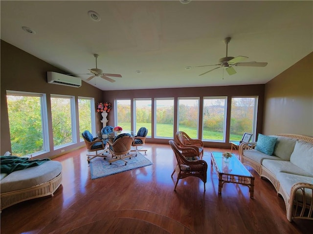 living room with hardwood / wood-style flooring, ceiling fan, lofted ceiling, and a wall mounted AC