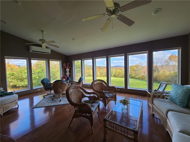 sunroom featuring a wall unit AC, a wealth of natural light, ceiling fan, and lofted ceiling