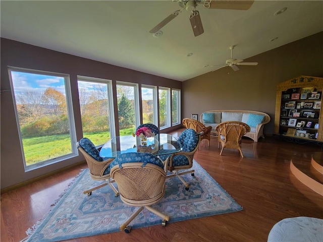 sunroom with ceiling fan and lofted ceiling