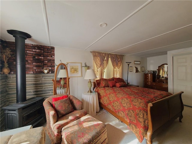 carpeted bedroom featuring a wood stove