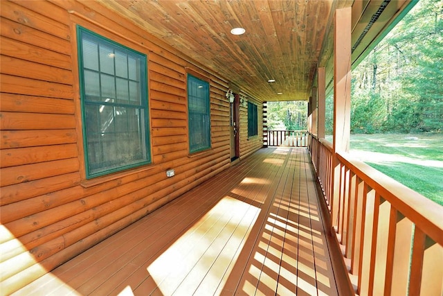 wooden terrace featuring covered porch