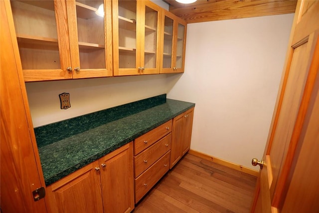 bar featuring light hardwood / wood-style flooring