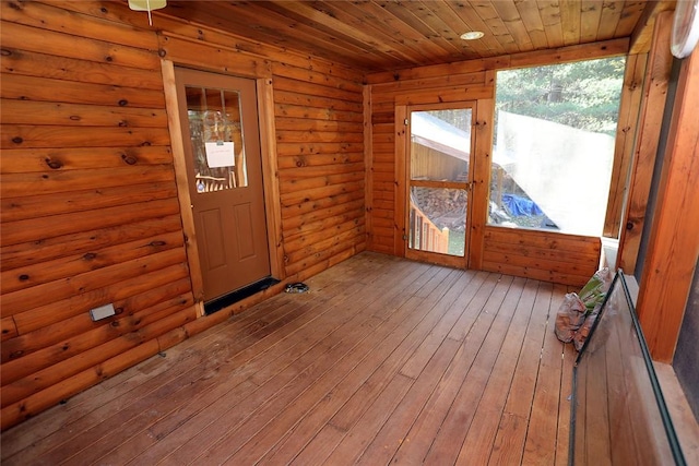 unfurnished sunroom featuring wood ceiling