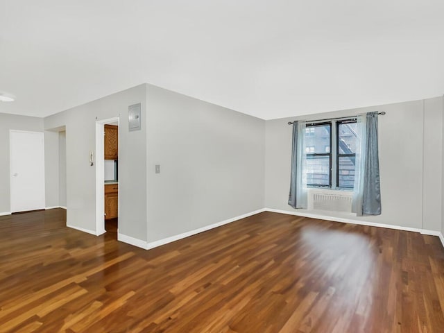 empty room featuring dark hardwood / wood-style floors