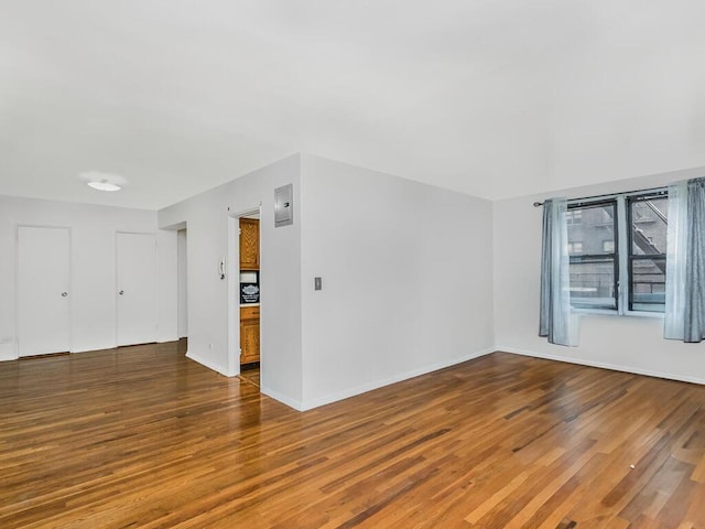 unfurnished room featuring dark hardwood / wood-style floors