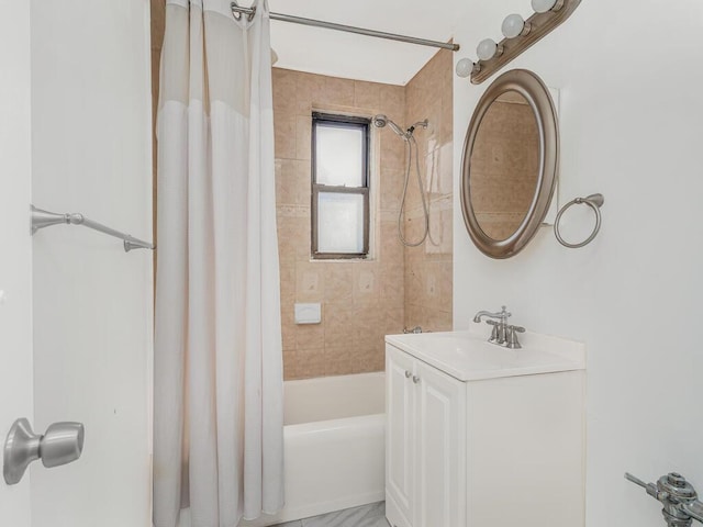 bathroom featuring vanity and shower / tub combo with curtain