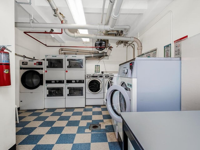 washroom featuring stacked washing maching and dryer and washer and dryer