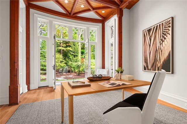 interior space featuring vaulted ceiling with beams and wood ceiling