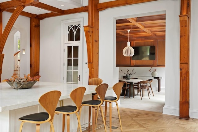 interior space featuring beam ceiling, light parquet floors, and coffered ceiling