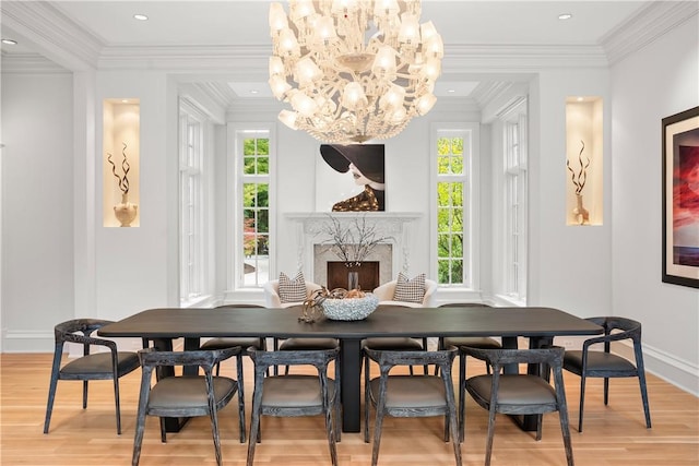 dining room featuring plenty of natural light, hardwood / wood-style floors, and ornamental molding