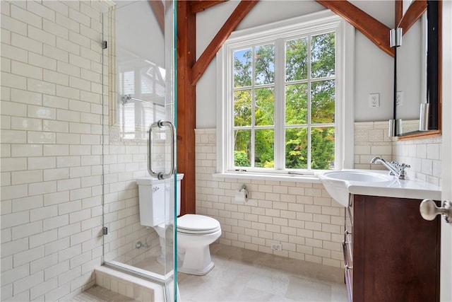 bathroom featuring walk in shower, vanity, tile walls, tile patterned flooring, and toilet