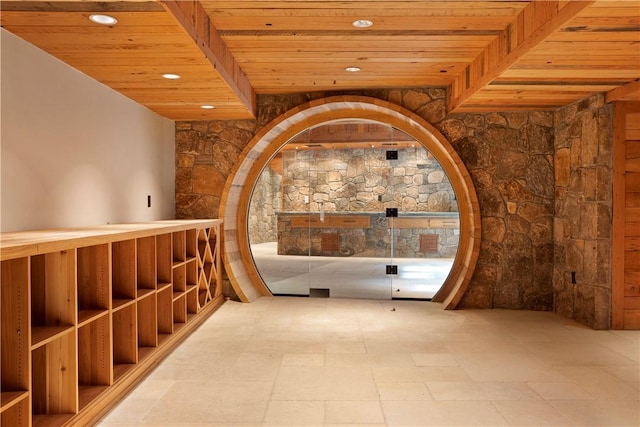 wine room featuring wood ceiling