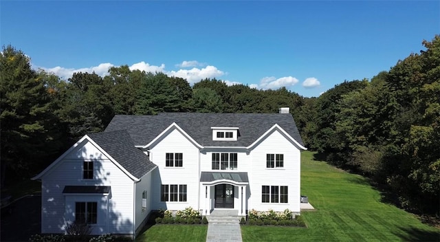 view of front of home with a front lawn