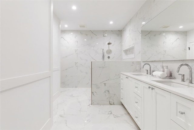 bathroom with tile walls and vanity