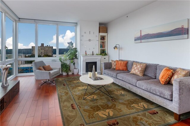 640 W 237th St Unit 12B, Bronx, NY 10463 - living room with expansive windows and wood-type flooring