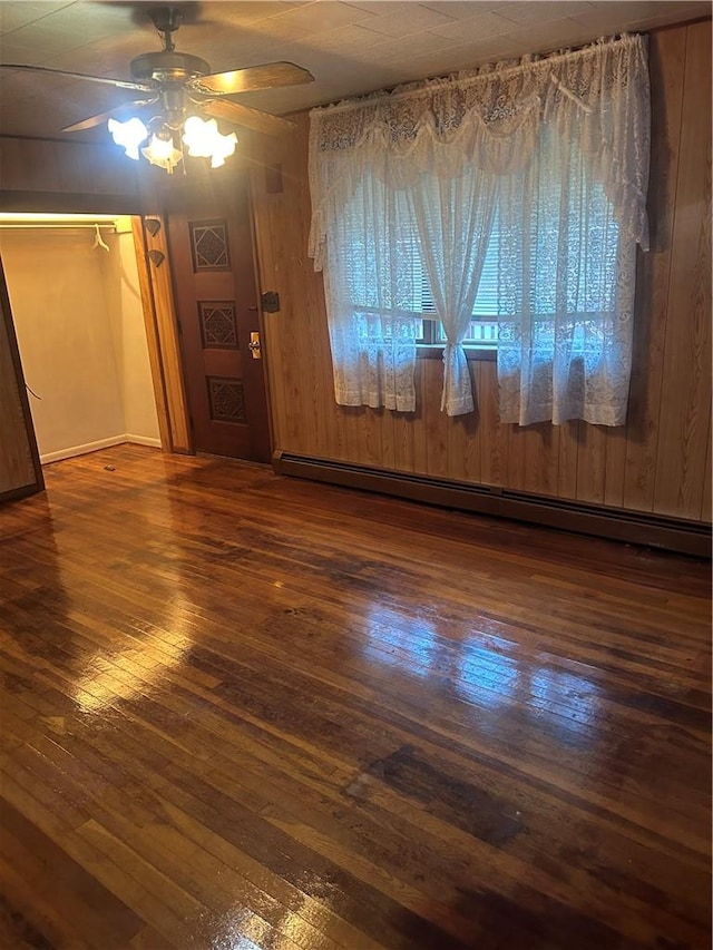 interior details with a notable chandelier and wooden walls