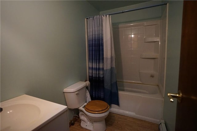 full bathroom featuring sink, a baseboard heating unit, hardwood / wood-style floors, toilet, and shower / tub combo