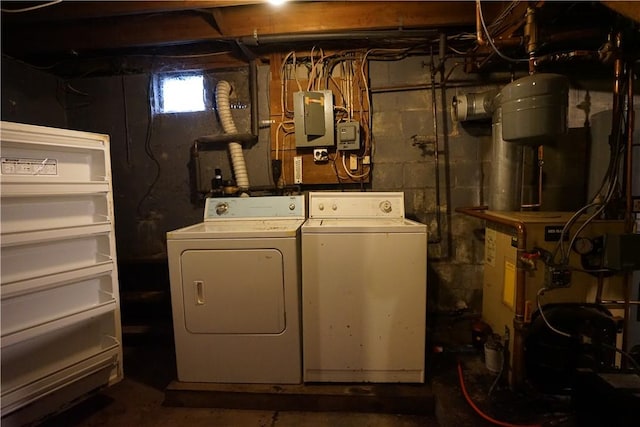 clothes washing area with washing machine and dryer