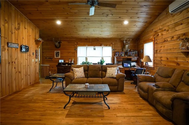 living room featuring a wall mounted air conditioner, wood walls, lofted ceiling, light hardwood / wood-style flooring, and wood ceiling