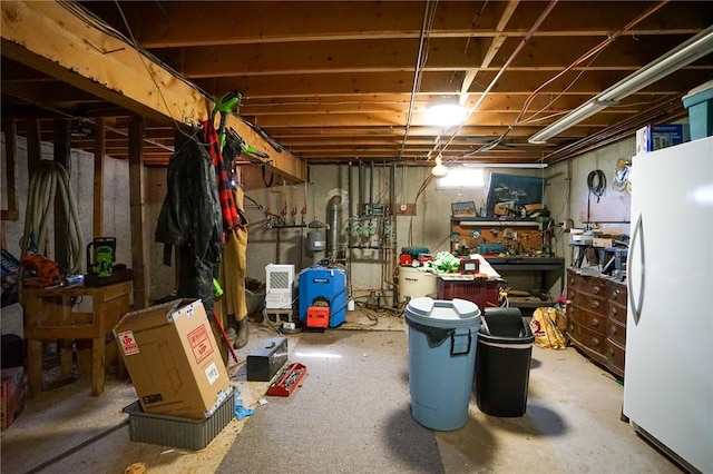 basement with white refrigerator