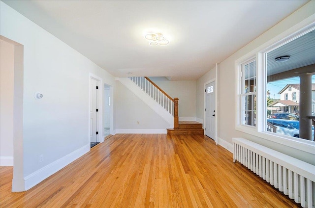 interior space featuring light hardwood / wood-style floors and radiator heating unit