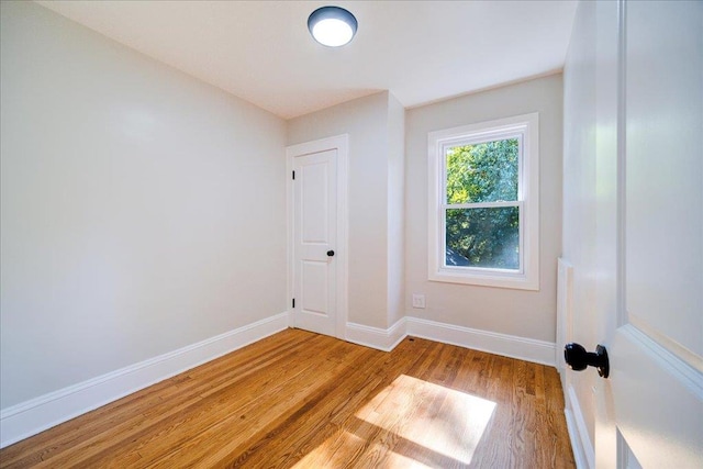 spare room featuring light hardwood / wood-style flooring