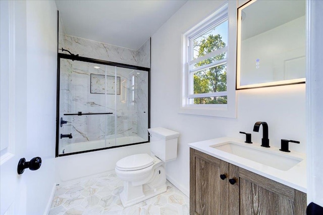 full bathroom featuring vanity, toilet, and combined bath / shower with glass door