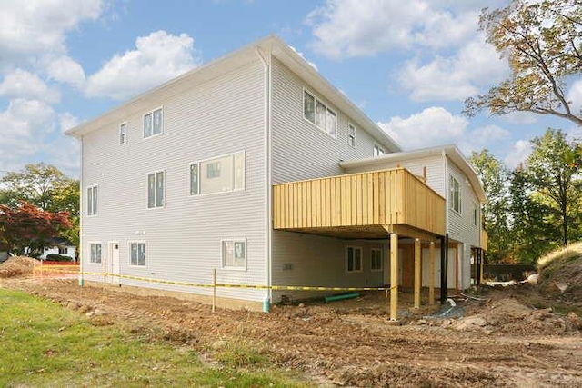 back of house featuring a deck