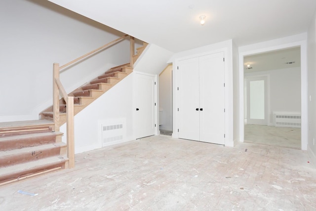 bonus room featuring visible vents and stairs