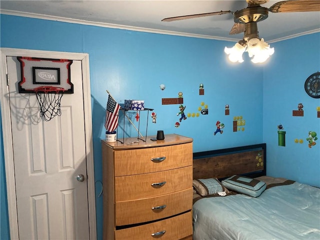 bedroom featuring ceiling fan and crown molding