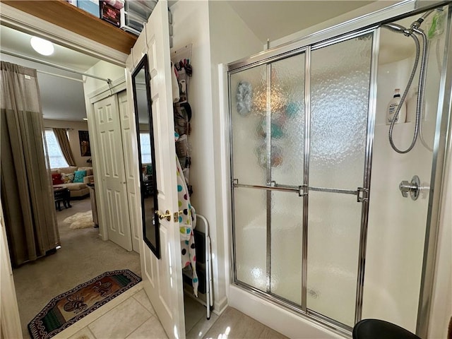 bathroom featuring tile patterned floors and an enclosed shower