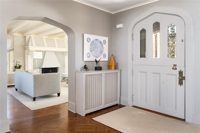 entrance foyer featuring beamed ceiling, dark parquet flooring, and crown molding