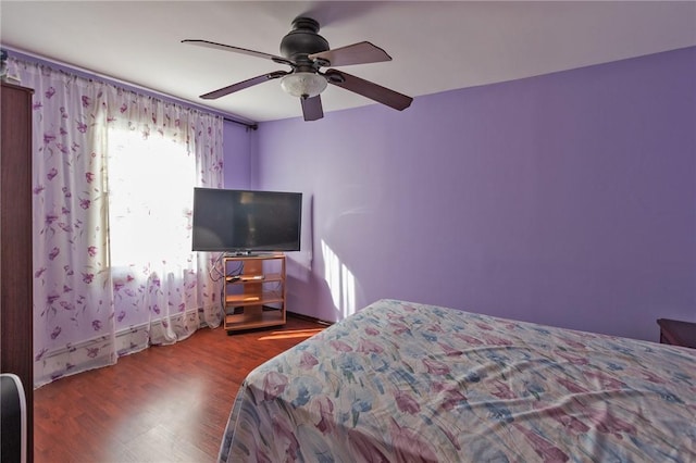 bedroom featuring hardwood / wood-style floors and ceiling fan