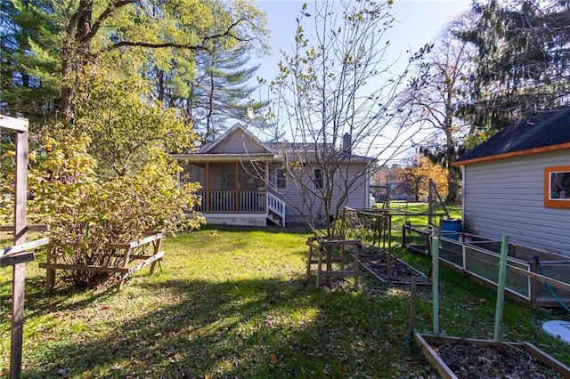 view of yard featuring a sunroom