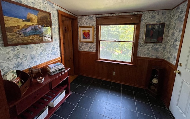 doorway featuring wood walls