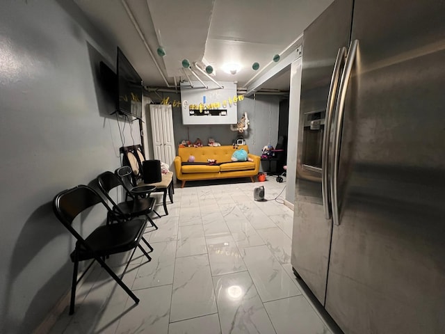 interior space featuring stainless steel fridge with ice dispenser