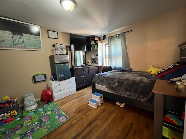 bedroom featuring hardwood / wood-style flooring