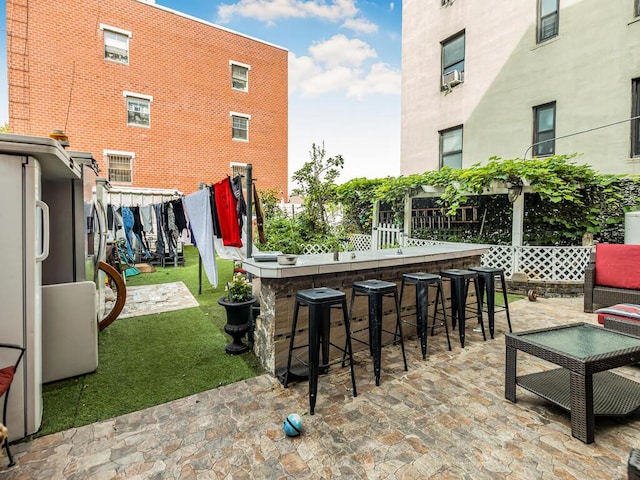 view of patio with a bar