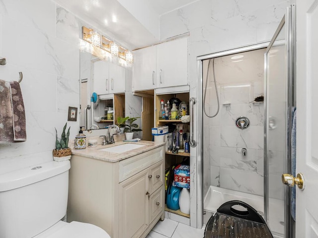 bathroom featuring vanity, toilet, and an enclosed shower